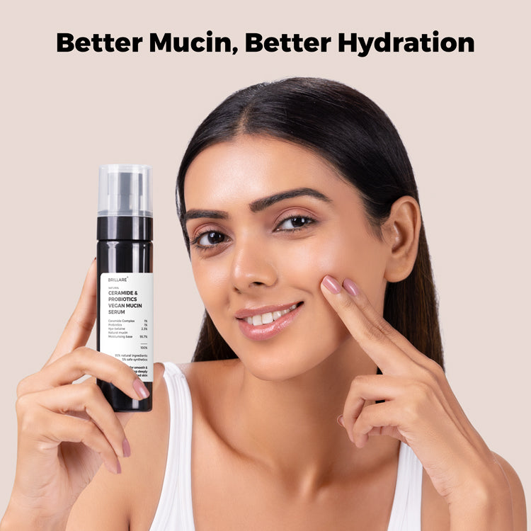 A Model holding Brillare Ceramide &amp; Probiotics Vegan Mucin Serum with side text include: Better Mucin, Better Hydration.